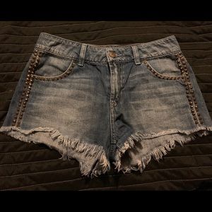 Guess gold stud denim jeans.